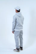 Men's gray jogger tracksuit with pullover hoodie and sweatpants, perfect for streetwear, workouts, or lounging.