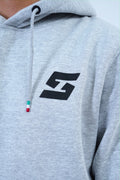 Gray pullover hoodie with black logo, featuring drawstring detail, part of men's jogger tracksuit set for casual and workout wear.